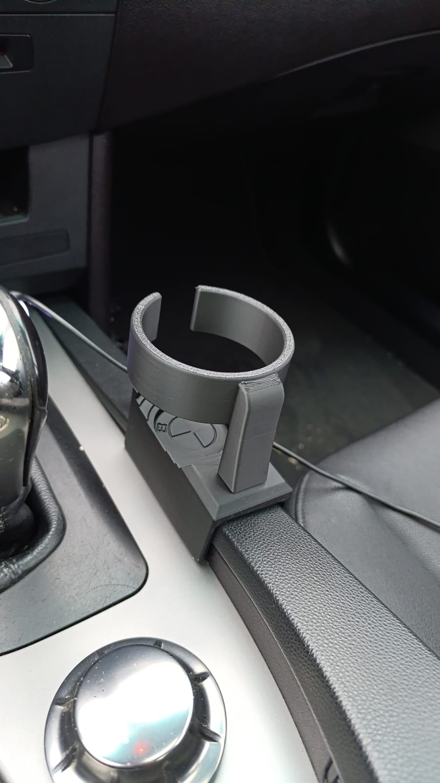 BMW E60/E61 puodelių laikiklis
