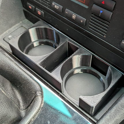 BMW E39 puodelių laikiklis