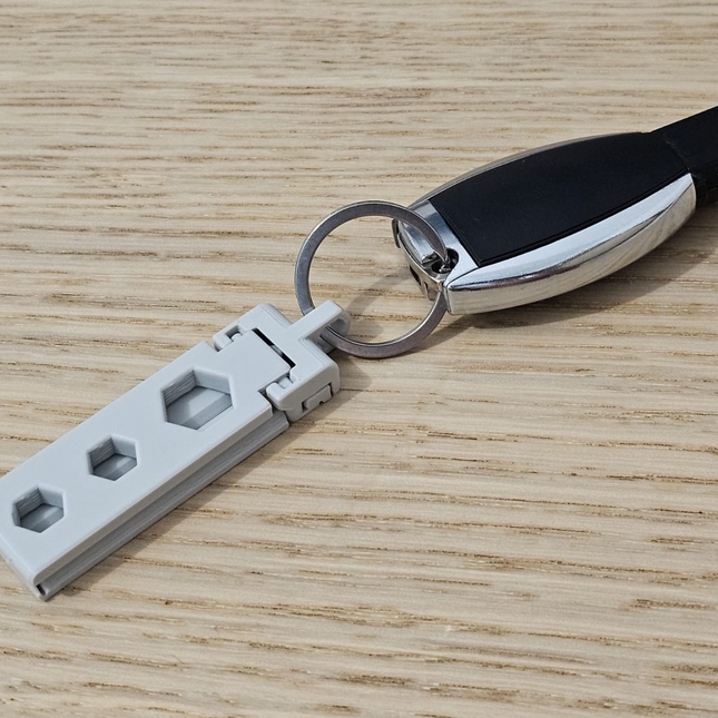 Sulankstomas telefonų stovas su automatiniais laikikliais