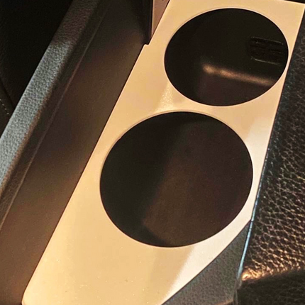 BMW E60/E61 puodelių laikiklis