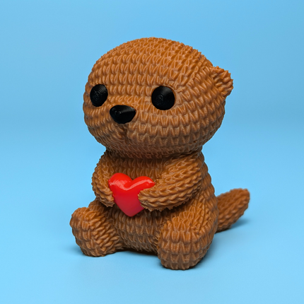 „Heartfelt Otter“ – Jaukus Megztas Ūdriukas su Širdelė
