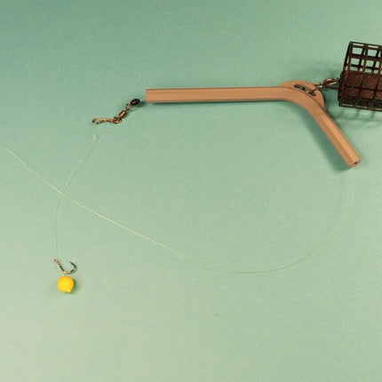 Antisusipainiojantis laikiklis fideriui (Anti-Tangle Boom)